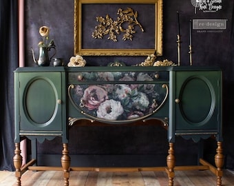 May include: A dark green antique sideboard with gold accents and floral patterned drawer fronts. The sideboard has two doors on each side and stands on four turned legs.