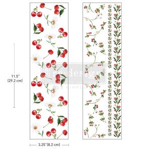 May include: Two white rectangular decorative transfers with cherry and daisy floral designs. One transfer features cherries and daisies, the other has a cherry vine design. The transfers are 29.2 cm long and 8.2 cm wide.