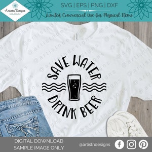 May include: A white t-shirt with a black and white graphic design that says "Save Water Drink Beer" with a stylized image of a glass of beer. The graphic is surrounded by three wavy lines to represent water.
