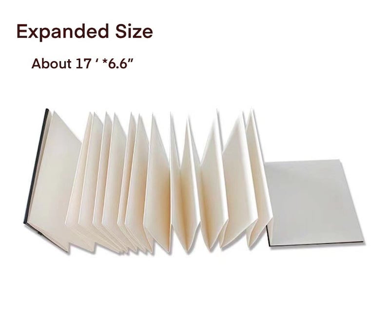 May include: A white accordion-style sketchbook with a black cover, expanded to show the pages. The sketchbook is about 17 inches by 6.6 inches.