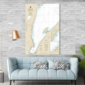 May include: A nautical chart of Kennebec Bay, Maine, printed on a cream-colored background with blue and black lines. The chart shows the coastline, islands, and waterways of the bay. The title "Kennebec Bay" is printed in black at the top of the chart.