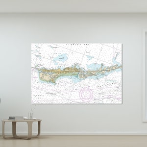 May include: A nautical chart print of Florida Bay, showing the coastline and waterways. The chart is printed in shades of blue, green, and brown, with white lines indicating depths and channels. The text "FLORIDA BAY" is printed at the top of the chart.