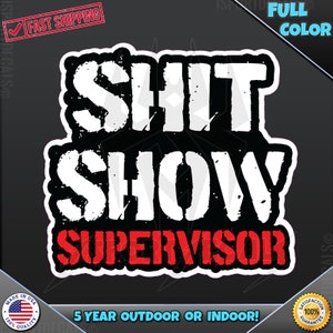 May include: A black and white sticker with the text "SHIT SHOW SUPERVISOR" in a distressed font. The word "SUPERVISOR" is in red. The sticker is designed for outdoor or indoor use and has a 5-year warranty.