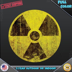 May include: A distressed yellow and brown radiation symbol on a black background. The symbol is a circle with three triangular blades. The text "FULL COLOR" is in the upper right corner. The text "5 YEAR OUTDOOR OR INDOOR!" is at the bottom.