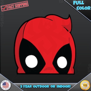 May include: Red and black cartoon character face decal with white eyes. The decal says "5 year outdoor or indoor!"
