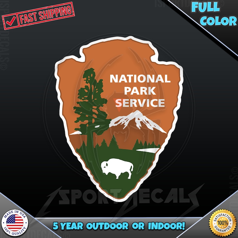 May include: A brown and green National Park Service sticker with a white outline. The sticker features a mountain, a tree, and a bison. The text "National Park Service" is printed in white on the sticker.