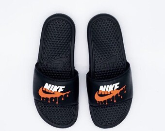 nike slides with gold check