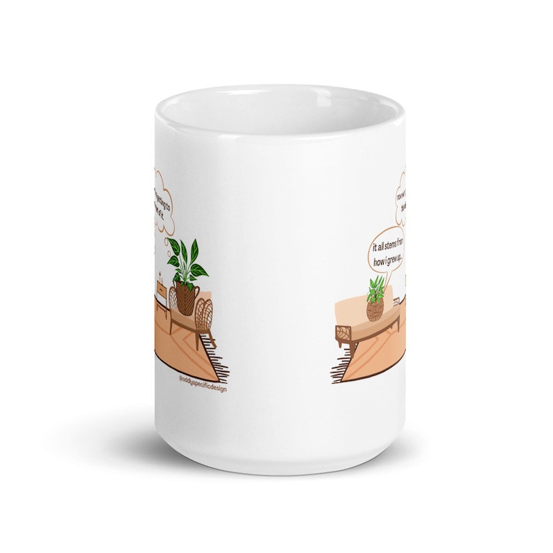 May include: White ceramic mug with a cartoon illustration of two potted plants on tables. The plants are thinking about how they grew up. The text on the mug reads "It all stems from how I grew up."