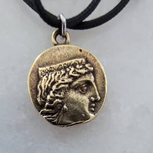 Pendentif pièce de monnaie Argos en bronze de la Grèce antique