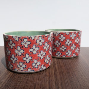Red stenciled ceramic planters