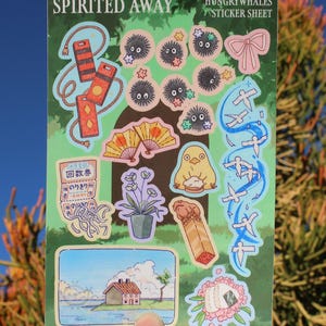 May include: A sticker sheet with illustrations from "Spirited Away." It includes images of soot sprites, a bow, fans, a bird, and a house. The text "SPIRITED AWAY" and "HUNGRYWHALES STICKER SHEET" are visible on the sheet.