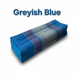 May include: A rectangular, blue floor cushion with a patterned center section. The cushion is a mix of solid and patterned fabrics in shades of blue and grey. The text "Greyish Blue" is displayed above the cushion.