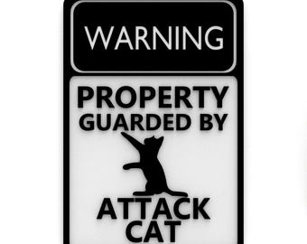 Señal divertida / Advertencia: propiedad protegida por gato atacante