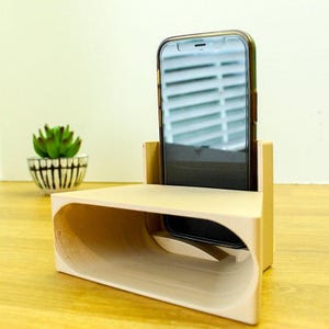 Soporte para teléfono con amplificador de sonido pasivo