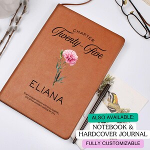 May include: A brown hardcover journal with the text "Chapter Twenty-Five" and the name "Eliana". A pink flower illustration is on the cover. The journal also has the text "Every chapter blooms with love, laughter, and all the wonders waiting for you."