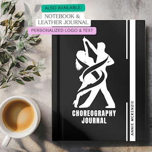 May include: Black journal with a white graphic of a dancing couple. The text "CHOREOGRAPHY JOURNAL" is below the graphic. The journal has a white vertical stripe with the name "ANNIE MCKENZIE". Additional text reads "ALSO AVAILABLE: NOTEBOOK & LEATHER JOURNAL PERSONALIZED LOGO & TEXT".