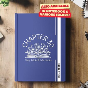 May include: A blue notebook with the text "CHAPTER 30" in white, surrounded by a floral design. The text "Tips, Tricks & Life Hacks" is below the floral design. The name "EMILIA JONES" is on the right side of the notebook.