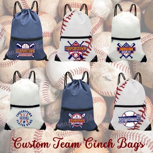 May include: A collection of custom team cinch bags in various colors, including white and navy blue. Each bag features a baseball-themed design with the text "COOPERSTOWN" and space for custom text. The bags have black drawstrings and a zippered front pocket.