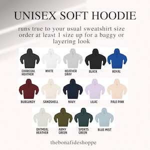 May include: A display of unisex soft hoodies in various colors, including black, white, royal blue, burgundy, navy, and pale pink. The text indicates the hoodies run true to size, with a suggestion to size up for a looser fit.