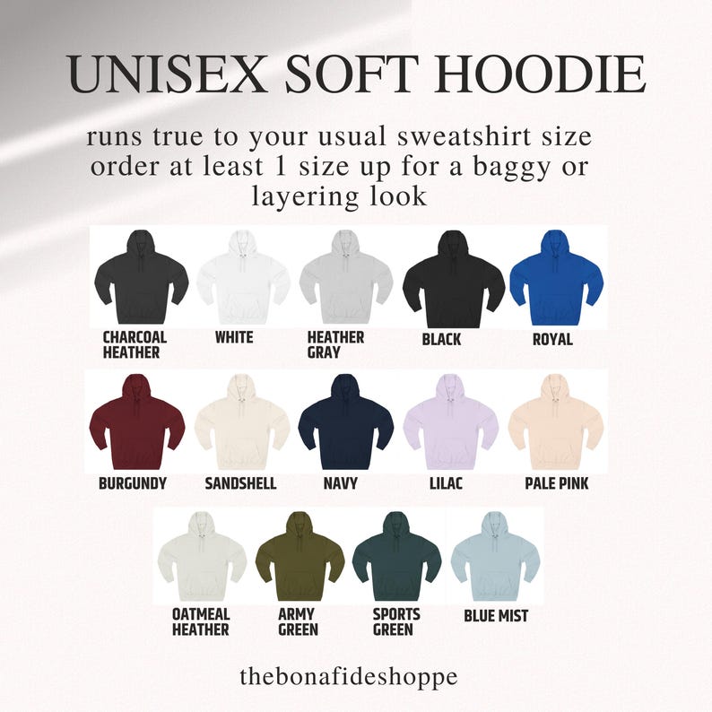 May include: A display of unisex soft hoodies in various colors, including black, white, royal blue, burgundy, navy, and pale pink. The text indicates the hoodies run true to size, with a suggestion to size up for a looser fit.