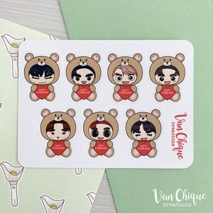 May include: Seven illustrated stickers of cartoon characters wearing brown bear costumes. Each character is holding a red heart with the text "GOT7 FOREVER" on it. The stickers are on a white background with the text "Van Chique creations" in the bottom right corner.