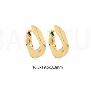 May include: A pair of gold hoop earrings with a slightly squared shape. The earrings measure 16.5x19.5x3.3mm.