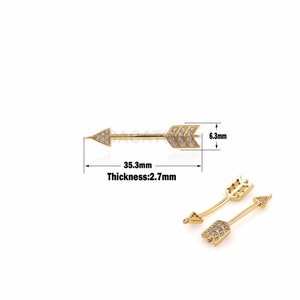 May include: Gold arrow body jewelry with clear rhinestones. The arrow is 3.5 cm long and 0.6 cm wide. Thickness: 0.27 cm.