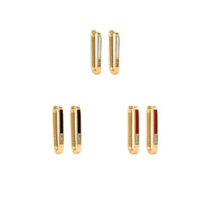 May include: Set of three pairs of gold hoop earrings with a single row of small clear cubic zirconia stones. Each pair features a different colored enamel insert: white, black, and red.