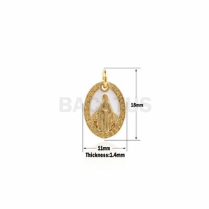 May include: Gold-toned oval pendant featuring a white enamel image of the Virgin Mary. The pendant measures 1.1 inches in length and 0.7 inches in width. The pendant is 0.14 inches thick.