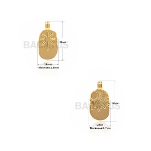 May include: Two gold-tone pendant charms with a star and sun design. The star charm is 1.8 mm thick and 12 mm wide. The sun charm is 1.7 mm thick and 12.8 mm wide.