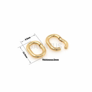 May include: Two gold-colored oval-shaped earrings. One earring is closed, and the other is open. The closed earring measures 12.5mm in length and 9.5mm in width. The thickness is 2mm. The earrings are on a white background.
