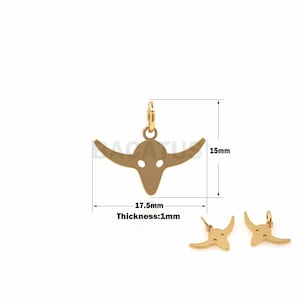 May include: Gold-toned metal bull head charm pendant with a loop for attaching to a chain or bracelet. The pendant measures 1.75 inches wide and 1.5 inches tall. The pendant is 1 millimeter thick.