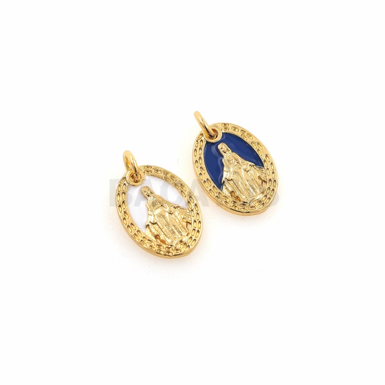 May include: Two gold-colored oval pendants with a religious image of the Virgin Mary. One pendant has a blue enamel background and the other has a white enamel background.