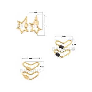 May include: Two gold star-shaped clasps with a black accent, measuring 22 mm by 31 mm, and two gold V-shaped clasps with a black accent, measuring 26 mm by 13.5 mm.