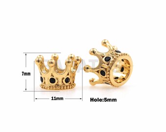 May include: Gold crown charm with black accents. The charm is 11 mm wide and 7 mm tall. The hole is 5 mm in diameter.