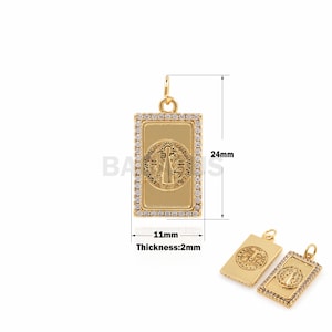 May include: Gold pendant with a rectangular frame and clear stones. The pendant features a religious image of the Virgin Mary. The pendant measures 24mm in height and 11mm in width. The thickness is 2mm.