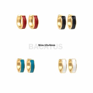 May include: Four pairs of gold hoop earrings with different colored enamel. The earrings are 13mm by 4mm. The colors are red, black, turquoise, and white.