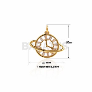 May include: Gold-tone pendant featuring a clock face with clear crystal accents and a ring around it, measuring 1.7 inches in diameter and 0.6 inches in thickness.