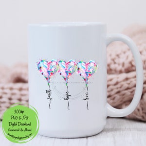 Pode incluir: Caneca de cer&acirc;mica branca com um desenho de tr&ecirc;s bal&otilde;es em forma de cora&ccedil;&atilde;o de aquarela com as palavras "f&eacute;", "esperan&ccedil;a" e "amor" escritas abaixo.
