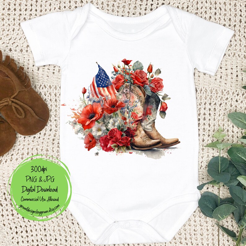 May include: A white baby bodysuit with a design of cowboy boots, red roses, and an American flag. The design is surrounded by watercolor splatters.