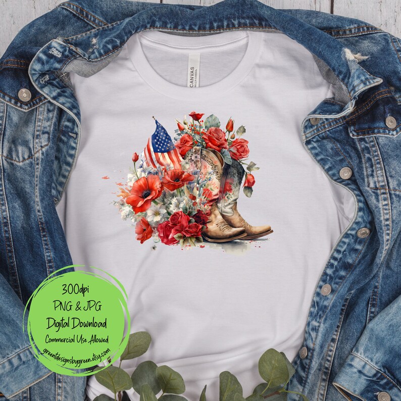 May include: A white t-shirt with a design of a pair of brown cowboy boots surrounded by red, white, and blue flowers. The design also includes an American flag.