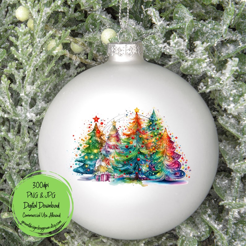 May include: A white Christmas ornament with a watercolor painting of colorful Christmas trees with stars and lights. The trees are green, blue, red, yellow, and orange.