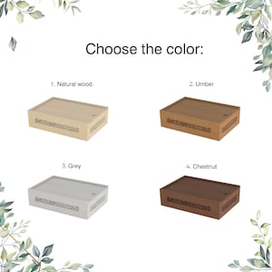 May include: Four wooden boxes with different finishes: natural wood, umber, grey, and chestnut. Each box has a decorative carved design on the front.