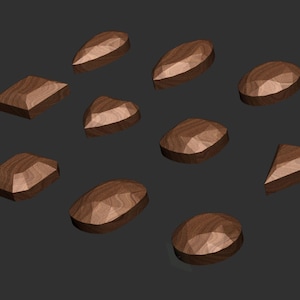 May include: A collection of twelve wooden gemstone shapes in various sizes and cuts. The shapes are all a rich brown colour and have a smooth, polished finish.