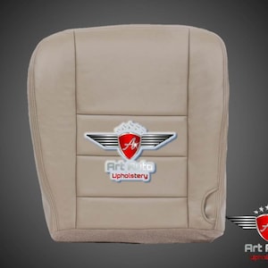 May include: Beige leather car seat cover with a silver and red logo that says "Art Auto Upholstery".