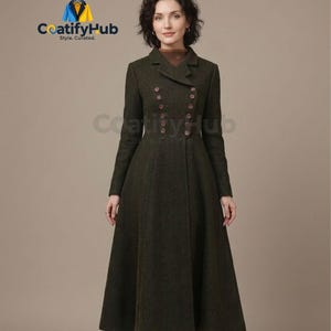May include: A long, dark green coat with a double-breasted design and a flared skirt. The coat features a classic collar and multiple brown buttons. The coat is a stylish outerwear garment.