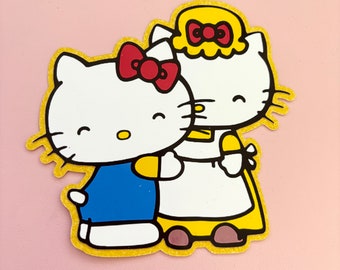 Decorazione per la festa della mamma a forma di gattino glitterato, con bouquet di fiori.
