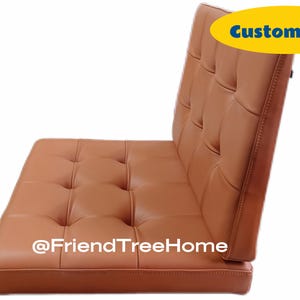 May include: A brown leather tufted cushion with a removable back. The cushion is available in custom sizes. The text "@FriendTreeHome" is printed on the cushion.