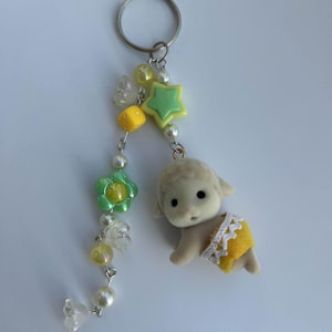 Fuzzy Critter Keychain: Kawaii Bag Charm with Yellow Beads