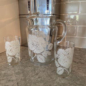 Vintage glass etched pitcher and two matching glasses